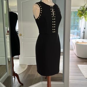 Black sleeveless cocktail dress.